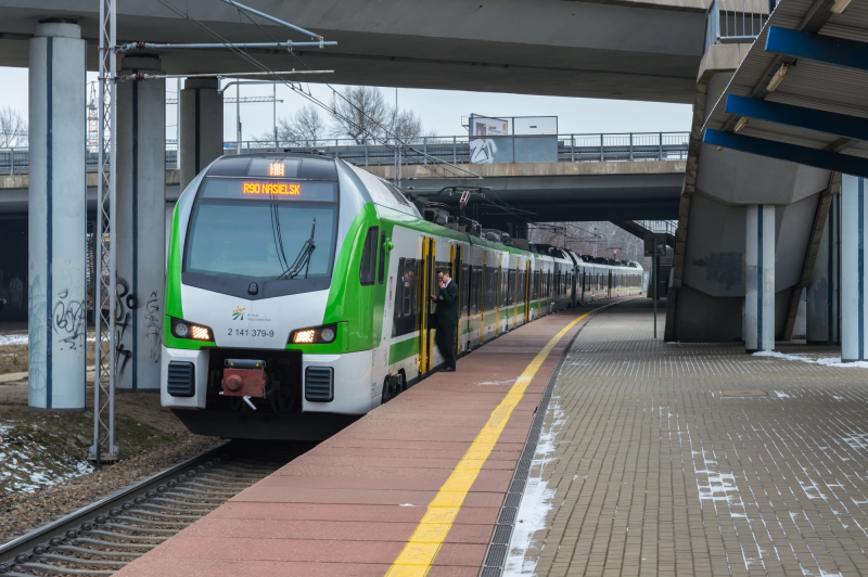 Photograph titled: km manager departing train